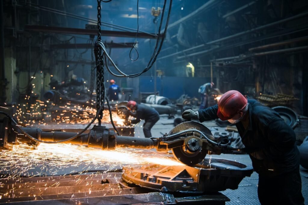 welder used grinding stone on steel in factory with sparks.jpg